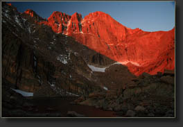 First minute of red morning sunshine on the Longs Peak