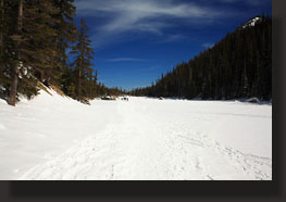 Hikers on a frozen Dream Lake