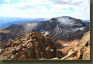 Dave on a false summit near Hagues Peak summit with Fairchild Mt behind