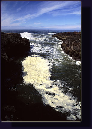 Waves break on the volcanic shore at Cape Perpetua