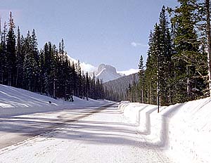 Driving west on Hwy 14 near Cameron Pass with the Nokhu Crags in the distance.