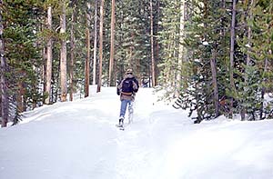 Mark slogging through the snow on the trail to Ranger Lakes, Dec 1997
