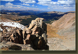 Cool rock outcrop overlooking a thousand-foot drop off the west side of Hagues Peak